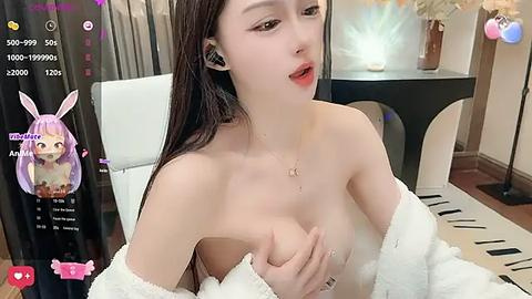 Media: Video of an East Asian woman with long, straight, purple hair and bunny ears, wearing a white robe, revealing her breasts.