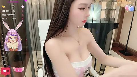 Media: Video of an East Asian woman with long black hair and bunny ears, wearing a strapless top, sitting at a table, captured through a virtual reality headset.