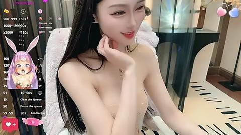 Media: Video of an East Asian woman with long black hair and pale skin, wearing a sheer top, smiling seductively. Background features a glass table with a keyboard.