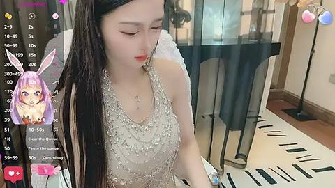 Media: Video of an Asian woman with long black hair, wearing a white lace dress, playing a piano in a modern room with a large window and black curtains.