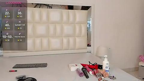 Media: A video of a modern, minimalist bathroom with a white vanity, LED mirror, and various cosmetic products, including a white pump bottle, makeup brushes, and a red lipstick.