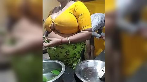 Media: Video of a woman with medium skin tone, wearing a yellow top and green floral pants, preparing vegetables on a kitchen counter.