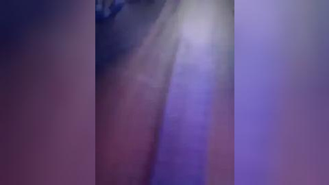 Media: A blurred, abstract video featuring indistinct, layered shades of purple and blue, creating a soft, dreamlike atmosphere. The image lacks discernible objects or subjects, emphasizing a sense of mystery and depth.