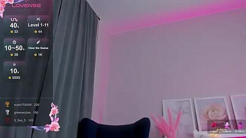 Media: Video of a modern room with a purple wall, pink accents, and a dark chair. A virtual reality interface overlaid with stats and a pink flower.