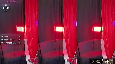 Media: Video of a virtual reality setup showing a red curtain with a glowing yellow light behind it. A user wearing a VR headset and headphones is visible.