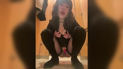 Media: Video of an Asian woman in a squat, black lingerie, black stockings, and black shoes, in a wooden closet setting.