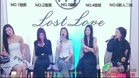 Media: Video of four Asian women seated on chairs, singing into microphones, dressed in casual, elegant attire, against a soft blue backdrop with \"Last Love\" written in cursive.