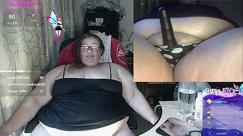 Media: Video montage: A plus-sized woman with glasses and black top, sitting on a gaming chair, and a close-up of a black dildo near her vagina; both images are overlaid with social media text and virtual butterfly filters.
