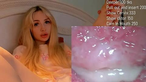 Media: Video of a blonde woman with fair skin, sitting on a bed, wearing a light pink top, with a close-up of her cervix labeled \"Deep Throat 10\" in text.