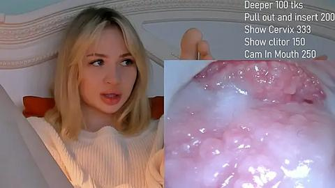 Media: Video of a young Caucasian woman with straight blonde hair and a white sweater, gazing curiously. Close-up of a pink, glistening vaginal opening. Text overlay: \"Deeper 1000+ Ks, Pull out and insert 20, Show clit 150, Cam in mouth 250.\