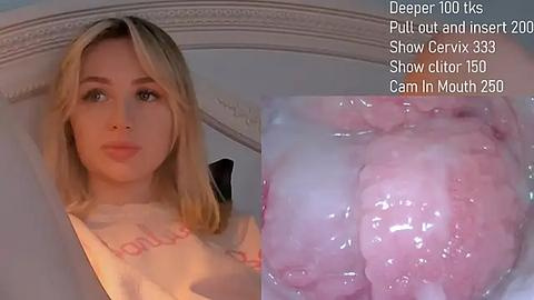 Media: A video of a young blonde woman with fair skin and a nose ring, wearing a white shirt, overlaid with an image of a pink, fleshy object.