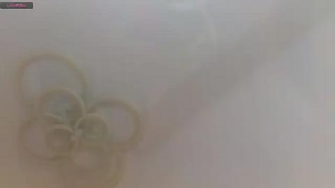 Media: A blurry video of a man and woman in an embrace, obscured by dense fog, creating a dreamlike atmosphere. Their faces are indistinct, and the background is a muted, foggy white.