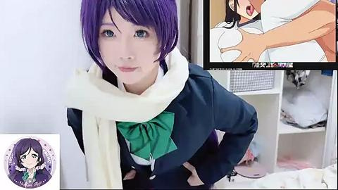 Media: Video of a cosplayer dressed as a schoolgirl, wearing a purple wig, green bow, and scarf. The background shows a messy room with clothes and a TV playing a hentai scene.