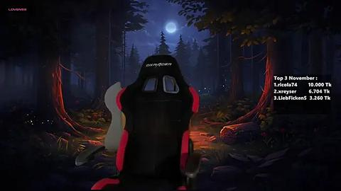 Media: Video of a gamer seated in a red and black gaming chair, facing a serene forest moonlit scene with a full moon. The background includes lush foliage and a glowing campfire.