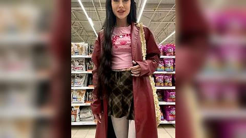 Media: Video of an Asian woman with long black hair in a grocery store, wearing a pink crop top, plaid skirt, and maroon trench coat, holding a pink bag.