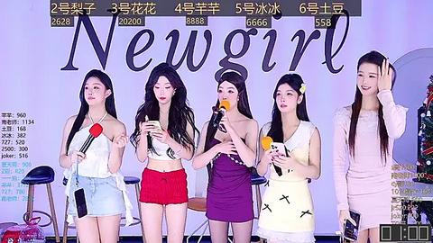 Media: Video of four East Asian women on a stage, holding microphones, dressed in casual, colorful outfits. Background displays \"New Girl\" in bold letters, with Chinese subtitles.