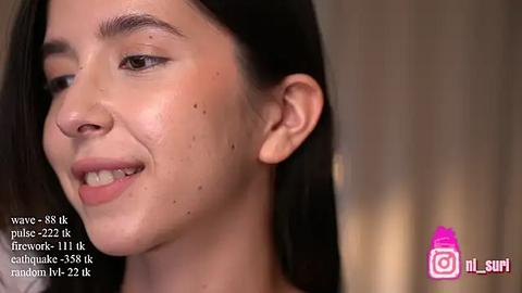 Media: Video of a young Asian woman with light skin and dark hair, smiling. She has acne on her face and a mole on her left cheek. Text overlay includes \"Plexus Elevate 111 kcahuake 55.5k t 22.1k\" and \"ml-siri\" branding.