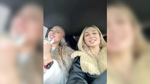 Media: A video shows two women with fair skin, smiling, wearing fur coats. The background is blurred, focusing on the subjects' joyful expressions.