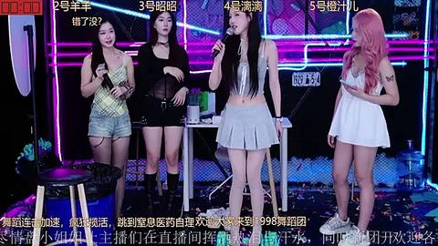 Media: Video of four young women with different hair colors and styles singing on stage. They wear casual, colorful outfits and are surrounded by a neon-lit, modern background.