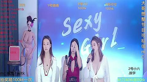 Media: Video of four Asian women, two in revealing outfits, speaking into microphones on a stage. Background features large \"Sex Girl\" sign, Chinese text, and financial ticker.