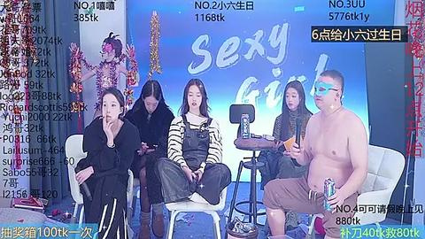 Media: Video of a live-streamed \"Sex Party\" event featuring four people seated around a table, two women in black attire, a man in glasses, and a shirtless man with a microphone.