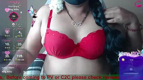 Media: A video of a woman in a red bra, with a virtual overlay showing a live stream, asking viewers to check out her channel.