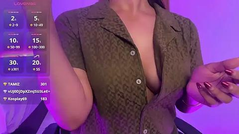 Media: Video of a woman with fair skin, wearing a partially unbuttoned olive green patterned blouse, showcasing cleavage. Background features a purple hue. Social media statistics overlay on the left.