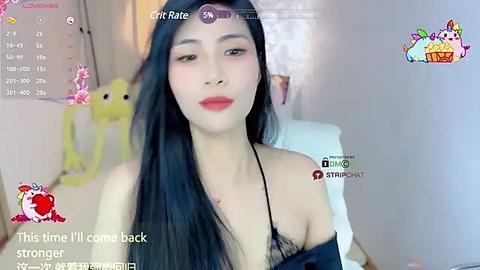 Media: Video of a young Asian woman with long black hair, wearing a black lace bra, sitting on a bed. The background features a yellow stuffed animal and a window. Text overlays read \"This time I'll come back stronger\" and \"CricRate 5.6.\