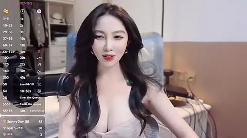 Media: Video of an East Asian woman with long black hair, fair skin, and red lipstick, wearing a revealing, low-cut white top, sitting in front of a webcam, with live streaming overlay.