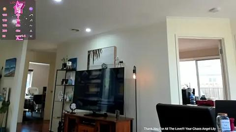 Media: Video of a modern living room with a large flat-screen TV mounted on a wooden stand, a white bookshelf, a window with beige blinds, and a star rating overlay on the top left.